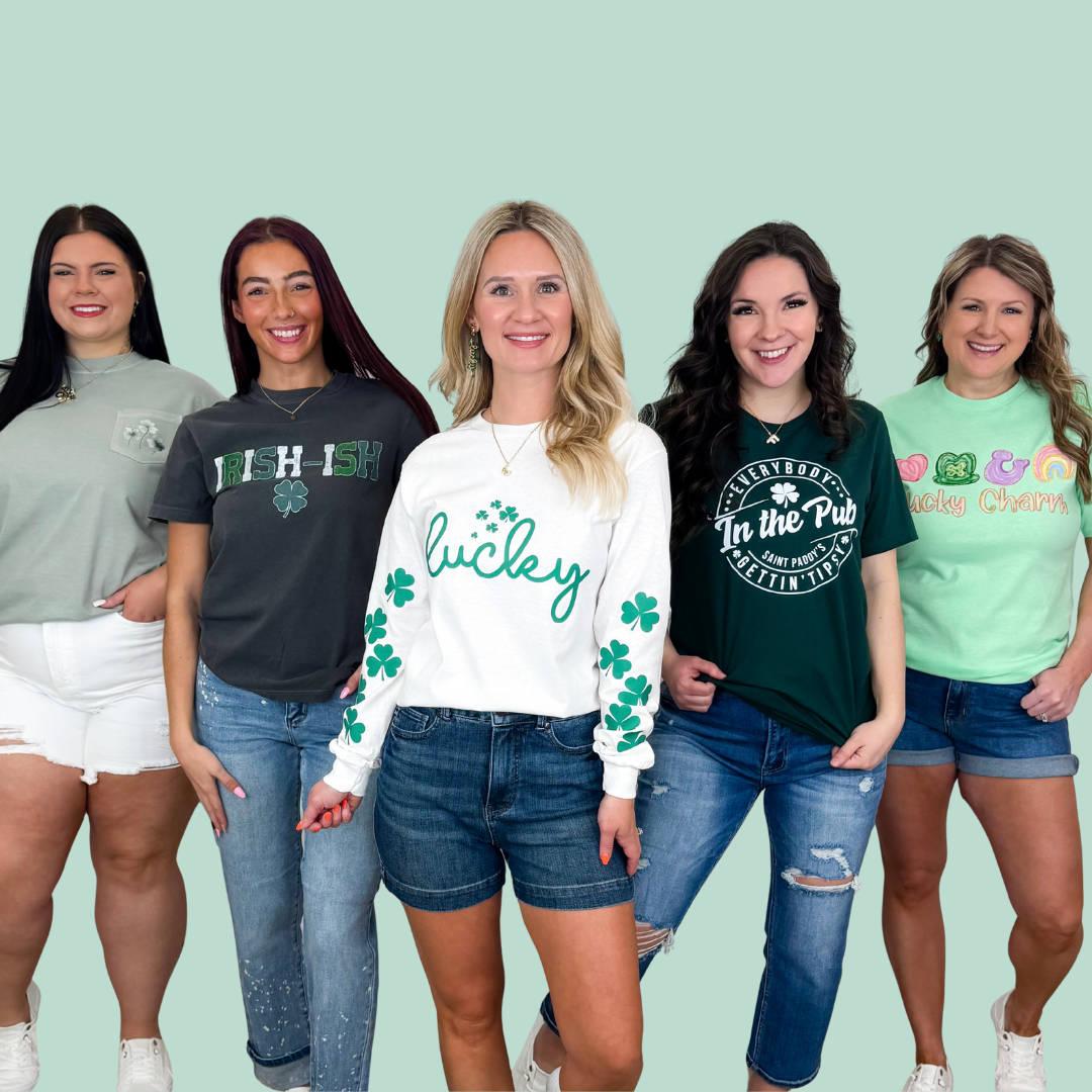 Five women wearing various St. Patrick's Day themed graphic shirts with different designs on a light green background.