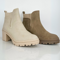 Avery Mae Boutique fall Chelsea booties with lug soles and block heels in cream and taupe suede.
