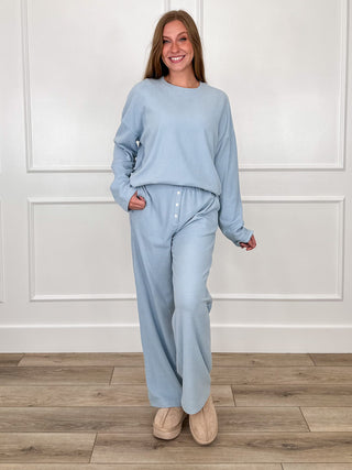Light blue high-rise striped pants with elastic waistband and side pockets