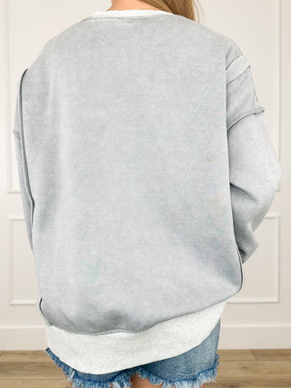 Heather gray long sleeve top, rear view, relaxed fit with V-neck seam