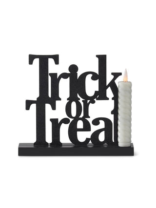 Black Trick or Treat LED decor with white pillar candle on base