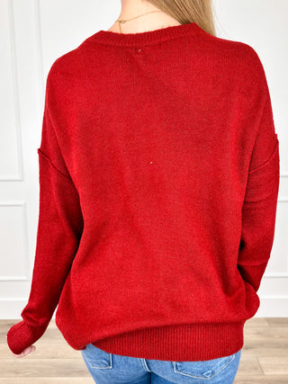 Red knit long-sleeve pullover sweater with crew neck and ribbed cuffs and hem