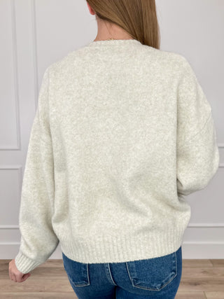 Oat knit long-sleeve sweater, back view with ribbed hem and cuffs