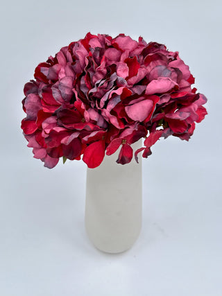 Burgundy faux hydrangea flower bundle in white ceramic vase