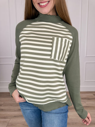 Green ribbed long sleeve mock neck top with horizontal stripe pocket panel