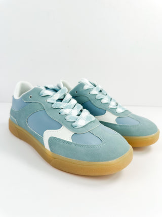 Light blue faux leather sneakers with gum sole and lace-up design.