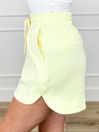 High-rise drawstring shorts, light yellow, elastic waist with tied drawstring