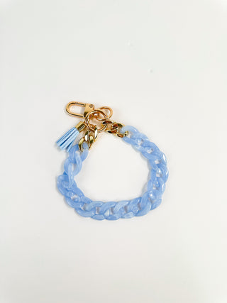 Light blue beaded chain wristlet keychain with gold clasp and tassel charm