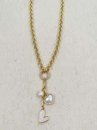Gold chain necklace with circular peace charm, faux pearl, and heart pendant