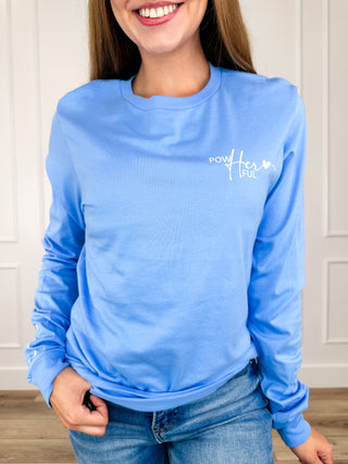 Blue long-sleeve graphic tee shirt with small chest text logo.