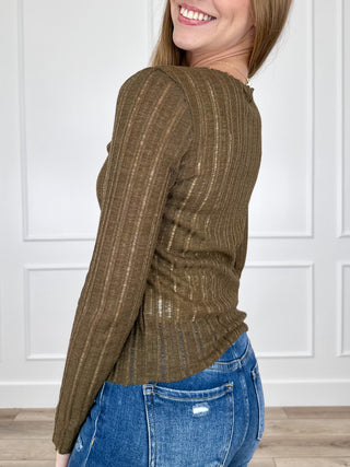 Brown long-sleeve knit top with textured vertical stripes and crew neck