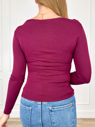 Purple long-sleeve rayon-blend top with back ruched detailing at the waist