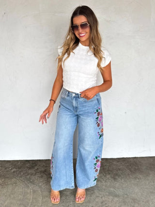 Lightweight white cropped top with short sleeves and textured pattern