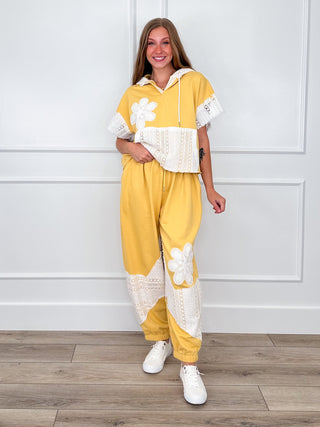 Yellow zip-hoodie and wide-leg pant set with white floral and lace trim