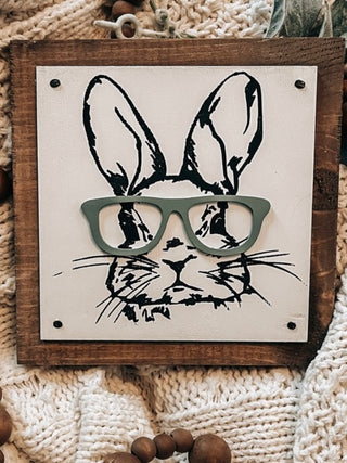Wood shelf sitter with white board, black rabbit face and green glasses print