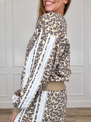Leopard print crewneck sweatshirt with long sleeves, striped side accents, and drawstring waist