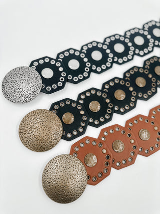 Faux leather belt with round stud medallions, dark navy and brass accents