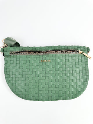 Green woven crossbody sling bag with zip top and adjustable shoulder strap