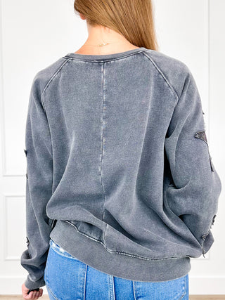 Grey long-sleeve crewneck sweatshirt, distressed star patch on back and sleeves
