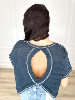 Navy knit cropped top back with large oval cutout and stitched trim