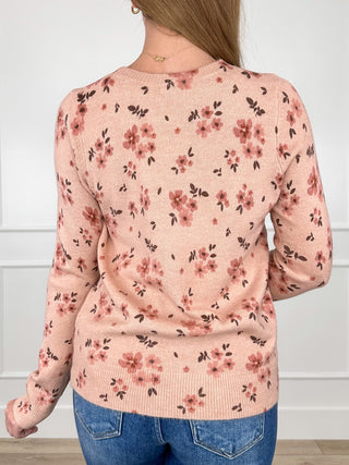 Pink knit long-sleeve floral sweater with crew neck and ribbed hem