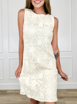 Cream lace sleeveless shift dress with round neck and floral textured pattern