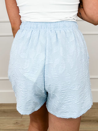 Women’s high-rise light blue textured shorts with drawstring and elastic waist
