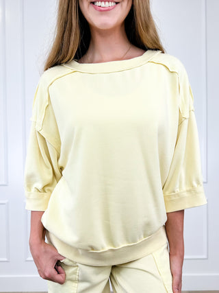 Yellow cotton-blend short-sleeve top with crew neck and gathered, cuffed sleeves