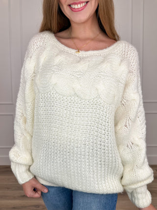 Ivory textured knit long-sleeve sweater with crew neckline and ribbed cuffs