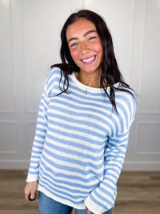 Blue-and-white striped knit sweater top with crew neck and long sleeves