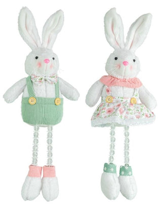 Plush bunny shelf sitter in green overalls and floral dress, with long white ears.