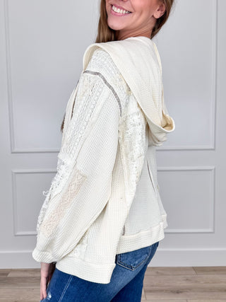 Cream hooded lightweight shacket with textured knit look and drawstring hood, side view