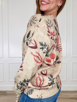 Oat knit sweater top with long sleeves and floral botanical print, side view