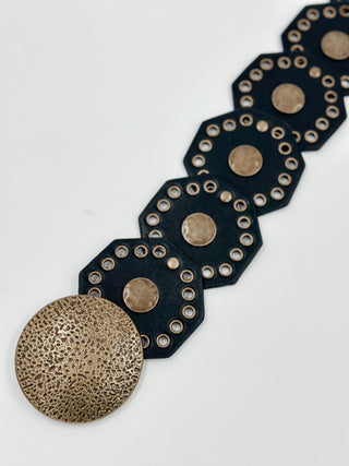 Faux leather belt with round stud medallions, dark navy strap and bronze buttons