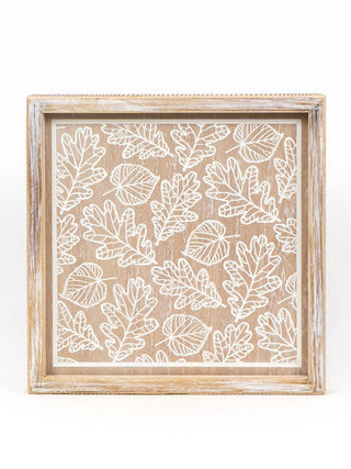 Reversible wood shelf sitter with leaf pattern in light wood frame, white line design