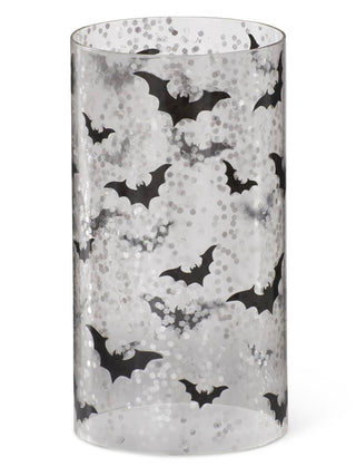 Glass candle slip cover with black bats over gray speckled background, cylindrical