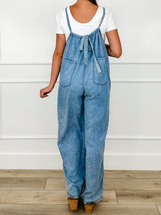 Cotton-blend Avery Mae jumpsuit in blue, tie front and two chest patch pockets