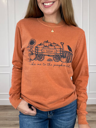 Orange long-sleeve cotton graphic tee with pumpkin wagon print