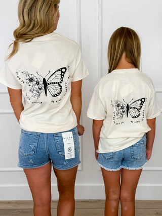 Kids cream short-sleeve graphic tee shirt with butterfly design, back view