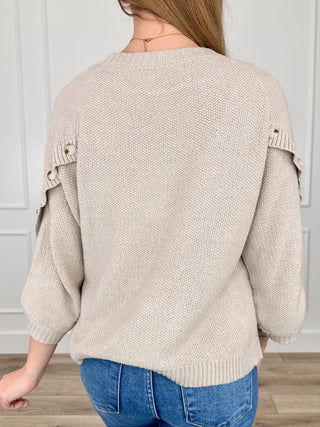 Oat knit sweater back view, crew neck, ribbed hem and 3/4 buttoned cuffs