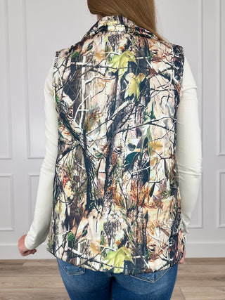 Camouflage puffer vest back view with stand collar and quilted multicolor pattern