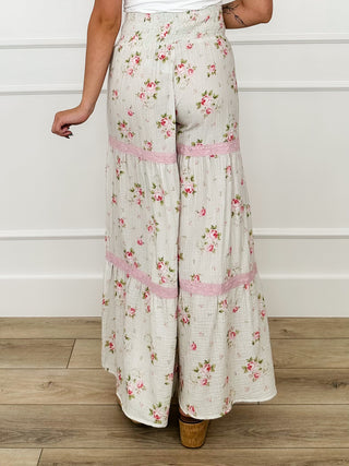 High-rise cotton palazzo pants, cream floral print, wide-leg tiered ruffle stripes