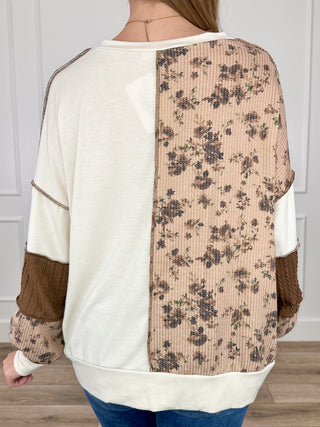 Cream and brown knit long-sleeve top with floral back panel and contrast trim