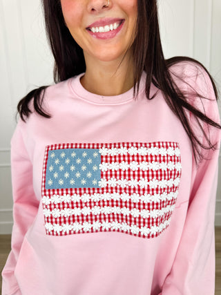Pink lightweight crewneck sweatshirt with long sleeves and star-spangled striped graphic