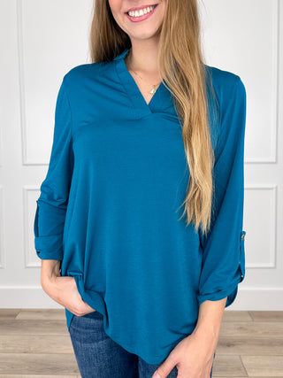 Teal blue gabby top with V-neck and 3/4 sleeves, loose tunic hem