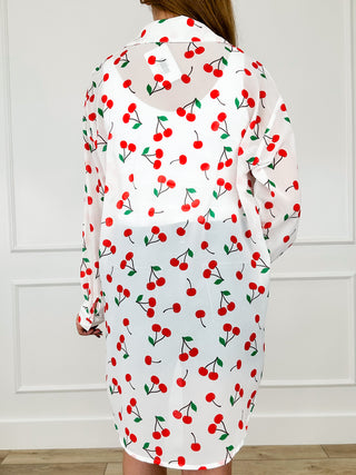 Lightweight long-sleeve button-up top, white with red cherry print, back view