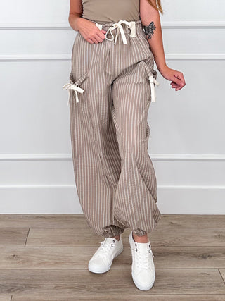 High-rise knit striped pants with elastic waist and drawstring, taupe pinstripe with tie details