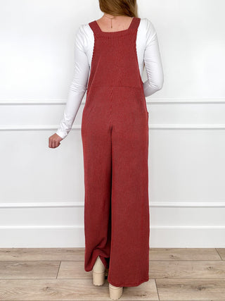 Wine red ribbed bib overalls with square neckline and adjustable shoulder straps