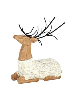 Sitting resin deer decor with a cream knitted body, wood-look finish and black antlers