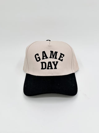 Game Day embroidered hat with beige crown, black brim, and black “GAME DAY” stitching